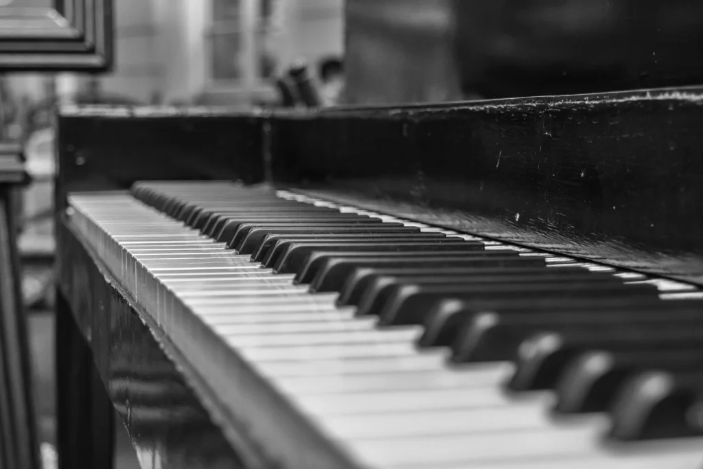piano lesson Artistic black and white close-up of piano keys in shallow depth of field.